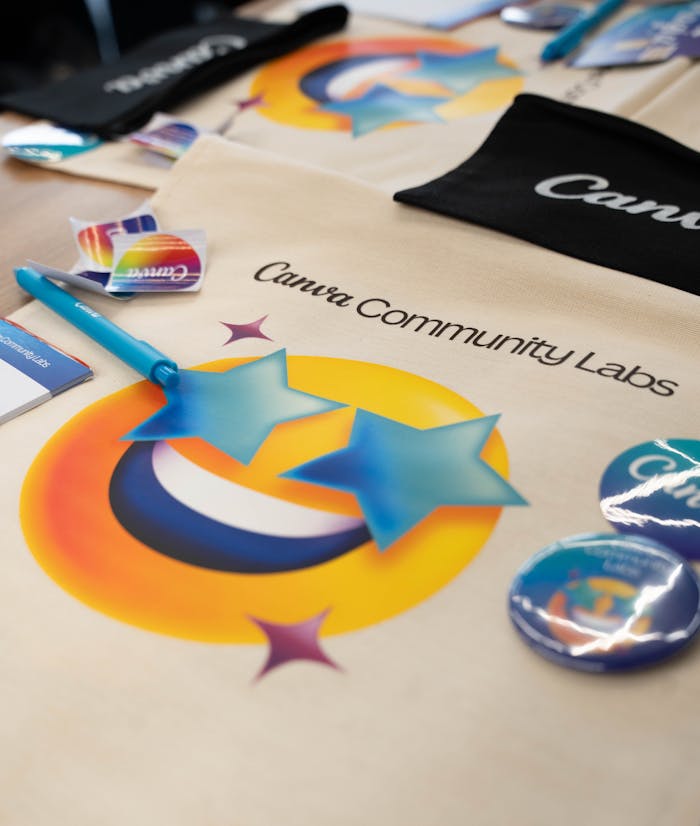 Home Creative display of Canva Community Labs merchandise showcasing branding and vibrant designs.